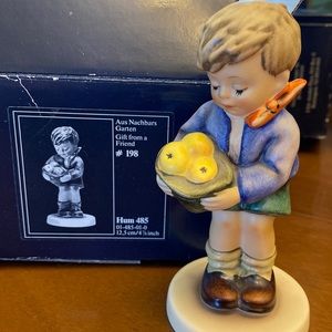 Hummel figure #198. “Gift from a Friend” very cute little boy.